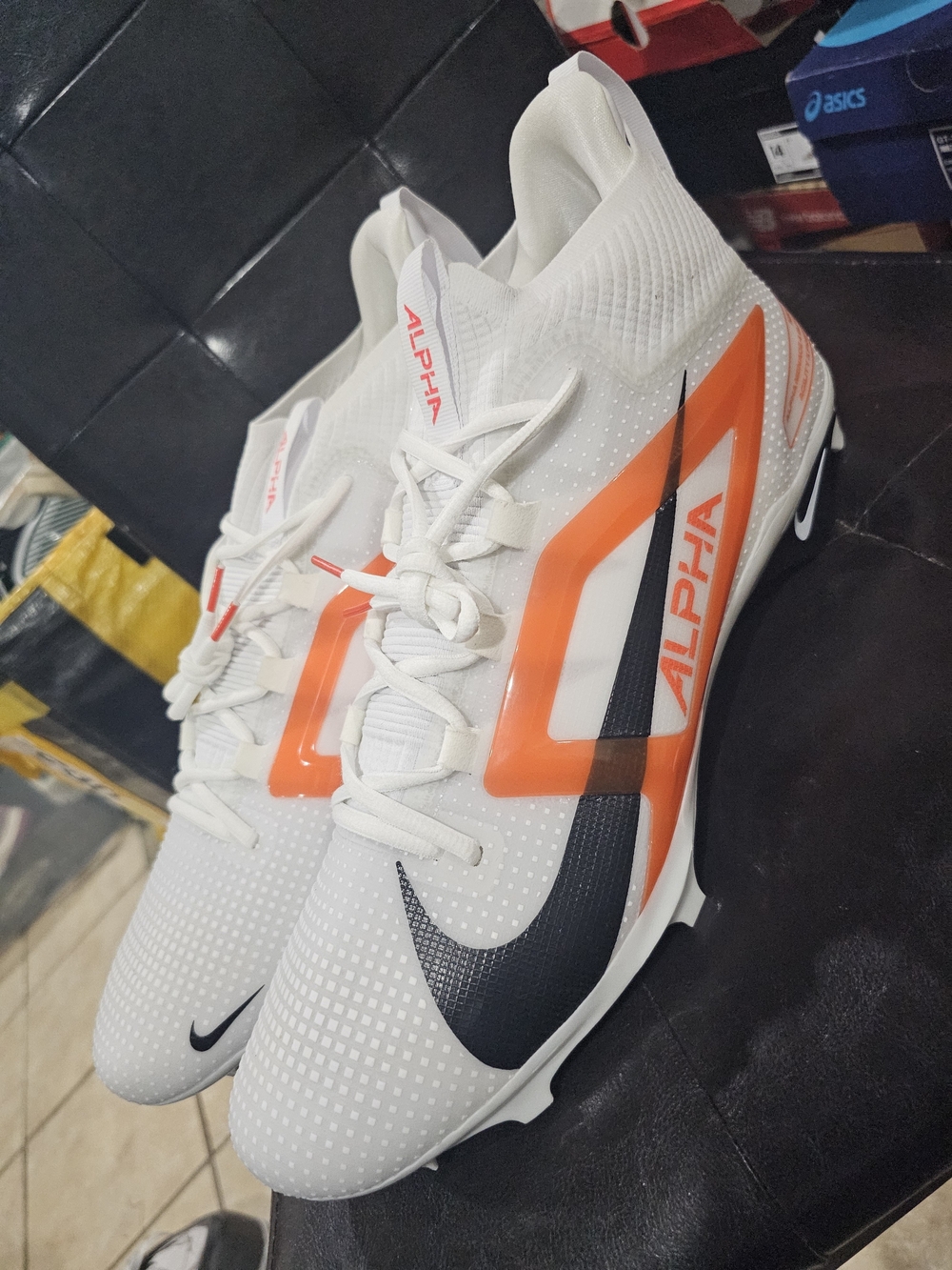 Nike Men’s White and Orange Alpha Athletic Cleats